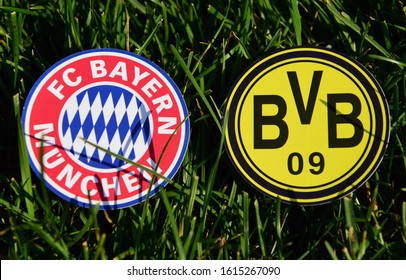 September 6, 2019, Munich, Germany. Emblems Of German Football Clubs Bayern Munich And Borussia Dortmund On The Green Lawn