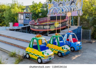 September 9, 2018; Seoul, South Korea: Coin Operated Cars (children's Rides) And Tilt A Whirl At Bankrupt Amusement Park.