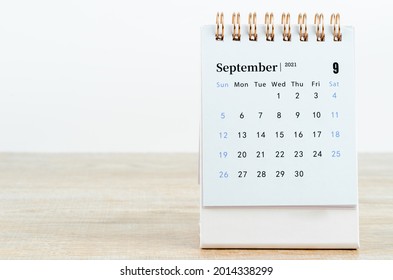 September Calendar 2021 on wooden table background.