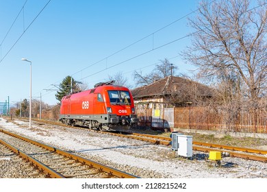 Septemvri, Bulgaria - Winter 2022: High-speed Electric Locomotive Siemens Taurus Austrian Railway Is On The Rails Of The Railway Station Waiting For A New Train. Sunny Weather. Bulgarian Railways