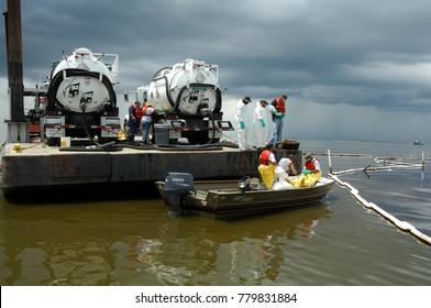 Septic Tank Pump Trucks On A Barge Pick-up And Separate Spilled Crude Oil From Water, Barataria Bay, Louisiana