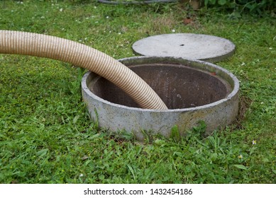 Septic tank: the removal of sewage sludge and cleaning of a domestic septic tank at rural French home.