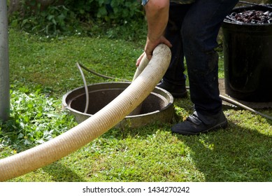 Septic Tank: The Removal Of Sewage Sludge And Cleaning Of A Domestic Septic Tank At Rural French Home.