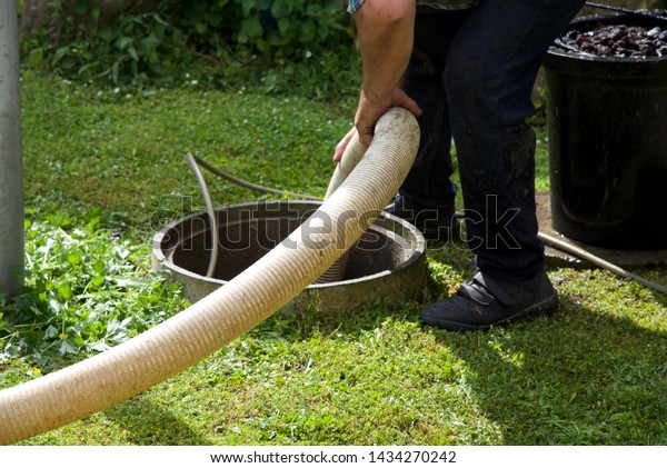 Septic tank: the\
removal of sewage sludge and cleaning of a domestic septic tank at\
rural French home.