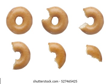 Sequence of bites taken off a donut isolated on white background