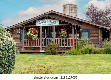 Sequim, WA USA - 07-18-2022: John L. Scott Realtor Log House Style Building