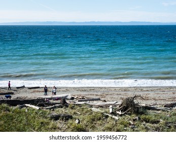 Sequim, WA, USA - August 5, 2020: People enjoying sunny weather on the Dungeness Spit, the longest sand spit in the US