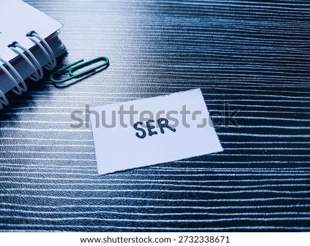 SER writting on table background. 