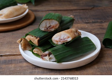 Serabi Solo.  Traditional pancakes from Solo, Central Java. Made from flour dough baked on a special clay plate.  Filled with various toppings then wrapped with banana leaf rolls 