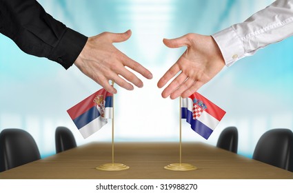 Serbia And Croatia Diplomats Agreeing On A Deal