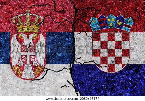 Serbia and Croatia painted flags on a wall with\
grunge texture. Serbia and Croatia conflict. Croatia and Serbia\
flags together. Serbia vs\
Croatia