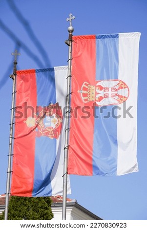 Serbian state flag and Serbian orthodox church flag together on Orthodox Easter Holiday