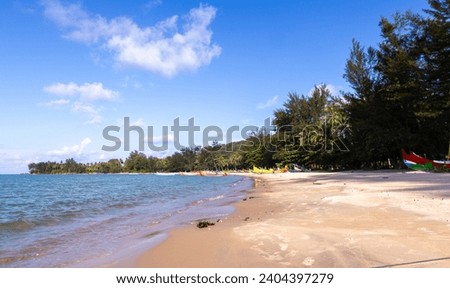 Serdang Beach is covered with pine trees with white sand