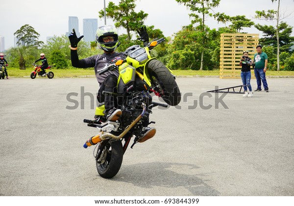 SERDANG, SELANGOR, MALAYSIA - JULY\
30, 2017 : Art of Speed in Malaysia. Honda Stunt man show. The\
biggest automotive event including motorcycle and cars.\
