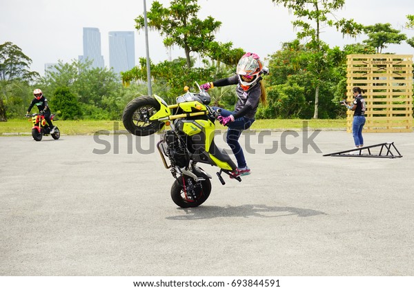 SERDANG, SELANGOR, MALAYSIA - JULY\
30, 2017 : Art of Speed in Malaysia. Honda Stunt man show. The\
biggest automotive event including motorcycle and cars.\
