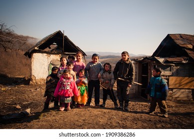 SEREDNIE, UKRAINE - MARCH 09, 2011: Kids Are Happy Not Paying Attention To Surrounding Poorness