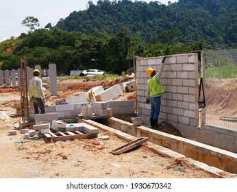 SEREMBAN, MALAYSIA -MARCH 15, 2020: Blockwork by construction workers at the construction site. Workers laying the AAC brick and stacked it together using mortar to form the wall. 

