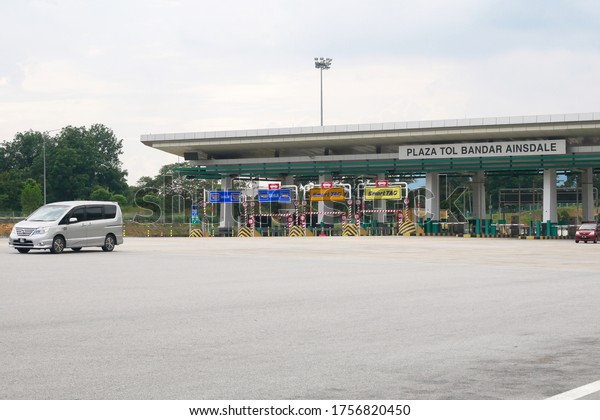 SEREMBAN, MALAYSIA -MAY 26,\
2020: Highway toll canopy in Malaysia. Vehicles that use the\
expressway through a toll plaza and make payments each time they\
enter and exit.
