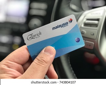 SEREMBAN, MALAYSIA - OCTOBER 14, 2017. Picture Of A Hand Holding The Malaysia Airlines Enrich Blue Card Inside A Car. The Enrich Program Is A Frequent Flyer Loyalty Program By The Malaysia Airlines.