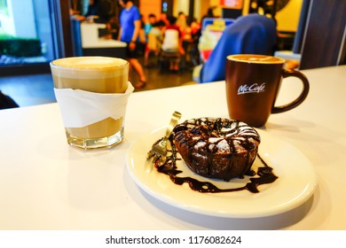 SEREMBAN,MALAYSIA - SEPT 04, 2018: Coffee Drink And Chocolate Cake At McCafe. McCafe Is A Coffee House Style Food And Drink Chain, Owned By McDonald's