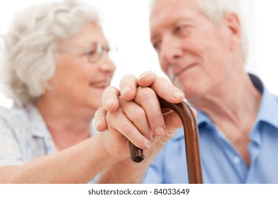 Serene aged husband and wife supporting and staying together during the old age