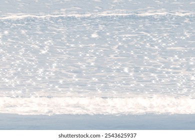 A serene beach background with soft blue tones. The background features gentle waves and a shimmering blue texture. Aesthetic sea water background. Blue background. - Powered by Shutterstock