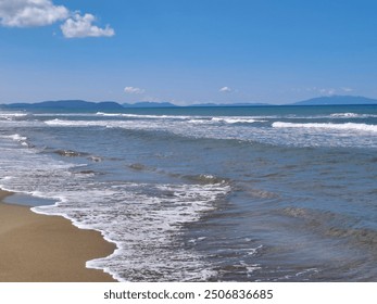  * A serene beach scene with soft sand, gentle waves, and a clear blue sky.
 * A tranquil coastal landscape with footprints leading towards the horizon. - Powered by Shutterstock