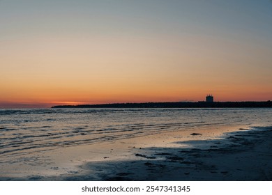 Serene beach scene at sunset with gentle waves and a calm horizon, creating a peaceful atmosphere with soft twilight colors reflecting on the wate - Powered by Shutterstock