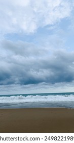 Serene Beachscape with Dynamic Cloudy Sky
