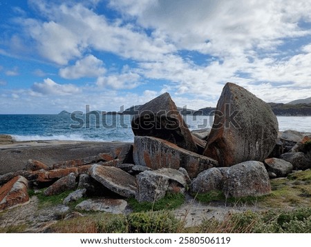 Similar – Image, Stock Photo A serene beachscape at Lariño with seagulls flying over gentle waves under a clear blue sky, reflecting tranquility and the beauty of Galicia