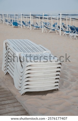 Similar – Image, Stock Photo Sunset reflections at Praia Emilia’s rocky beach