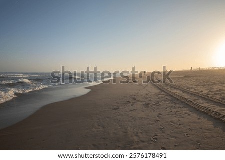 Similar – Image, Stock Photo Sunset reflections at Praia Emilia’s rocky beach