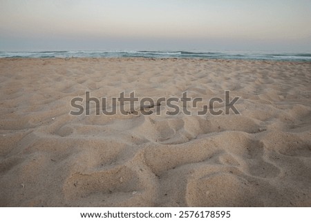 Similar – Image, Stock Photo Sunset reflections at Praia Emilia’s rocky beach