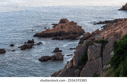 Serene Coastal Landscape Featuring Rocky Outcrops and Gentle Waves   - Powered by Shutterstock