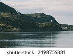 Serene Coastal Landscape with Lighthouse Overlooking Calm Waters, Teriberka, Murmansk district, Russia