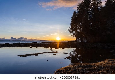 Serene coastal landscape at sunset in Port Renfrew, Vancouver Island, showcasing rocky shores and tranquil waters. Experience the natural beauty of British Columbia, Canada during a breathtaking view. - Powered by Shutterstock