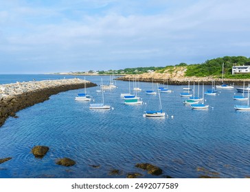 Serene Coastal Scene with Sailboats in Rockport Harbor, Rockport, Massachusetts, USA - Powered by Shutterstock