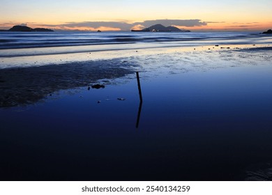 Serene Coastal Sunset with Vibrant Sky Reflections, Hong Kong - Powered by Shutterstock