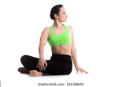 Serene Girl Practicing Yoga, Revolved Easy Pose, Gentle Spinal Twist, Parivrtta Sukhasana, Asana For Flexible Spine