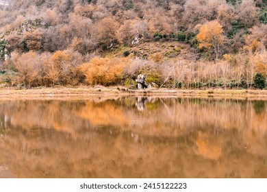 Serene Lake with a solitary tree
This picture is a calming image of a small, picturesque lake surrounded by lush greenery. In the center of the lake is a single tree, its branches reaching towards.... - Powered by Shutterstock