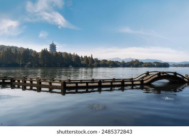Serene Lake with Traditional Pavilion and Wooden Bridge - Powered by Shutterstock