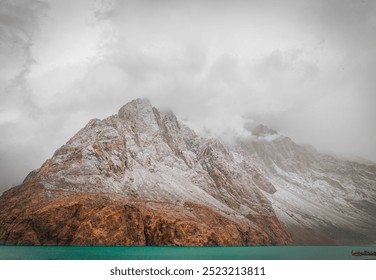 A serene mountain lake reflecting snow-capped peaks and lush greenery, capturing nature's tranquility and beauty in perfect harmony. - Powered by Shutterstock