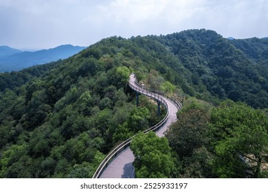 Serene Mountain Pathway Curving Through Lush Greenery   - Powered by Shutterstock