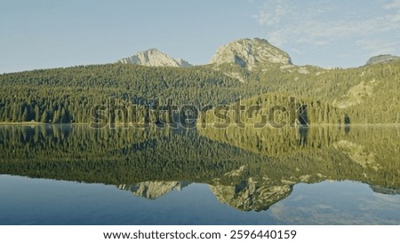 A Serene Mountain Reflection Over a Tranquil Lake in the Heart of Untouched Nature