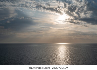 Serene Ocean Sunset with Dramatic Clouds, view from a ferry in Baltic Sea