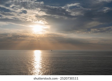 Serene Ocean Sunset with Dramatic Clouds, view from a ferry in Baltic Sea - Powered by Shutterstock