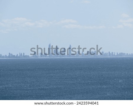 Serene Oceanfront View of a Modern City Skyline
