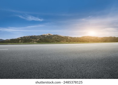 Serene Open Road at Sunrise with Mountain View - Powered by Shutterstock