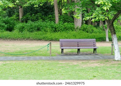 Serene Park Bench in Lush Green Setting - Powered by Shutterstock