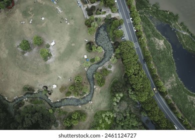 Serene Park by the Meandering River: Aerial Perspective - Powered by Shutterstock